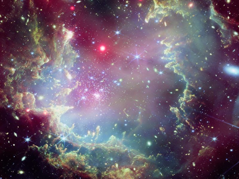 This image of the star cluster NGC 602, located on the outskirts of the Small Magellanic Cloud, combines data captured by NASA’s Chandra X-ray Observatory with an image taken by the James Webb Space Telescope's NIRCam (Near-InfraRed Camera). Credit: NASA